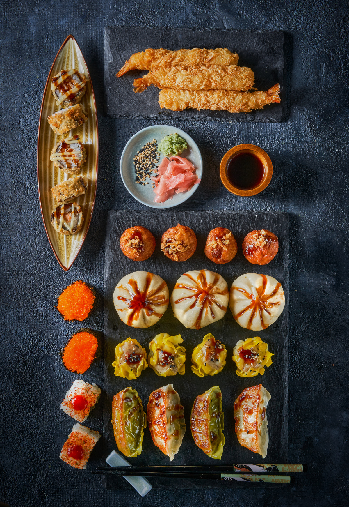 Assorted Chinese food set. Chinese gyoza dumplings, xiao long bao, shao mai, gunkan, fried takoyaki, Deep Fried shrimp Prawn Rolls tempura. Top view. Chinese restaurant concept. Asian style banquet.